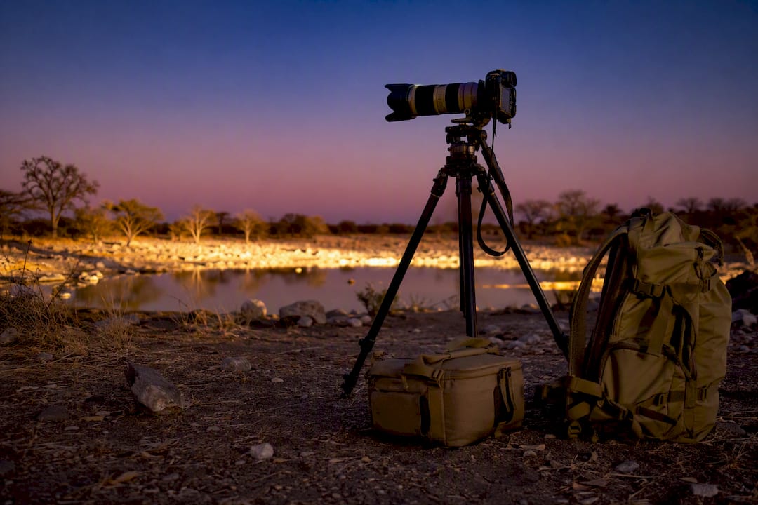 Camera and tripod set for floodlit waterhole photography