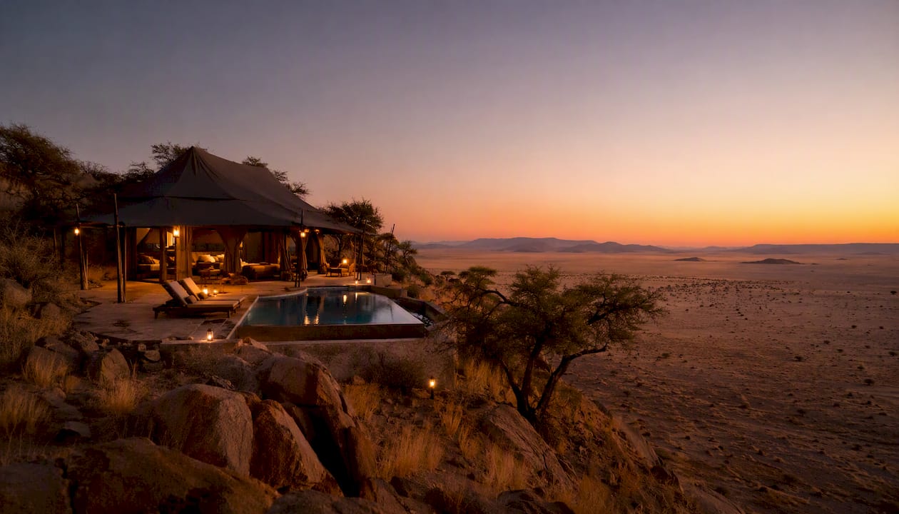 Luxury lodge and desert dunes in Namibia at dusk
