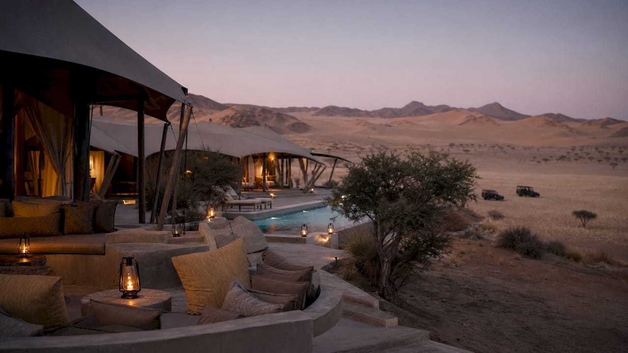 Luxury tented desert lodge at dusk