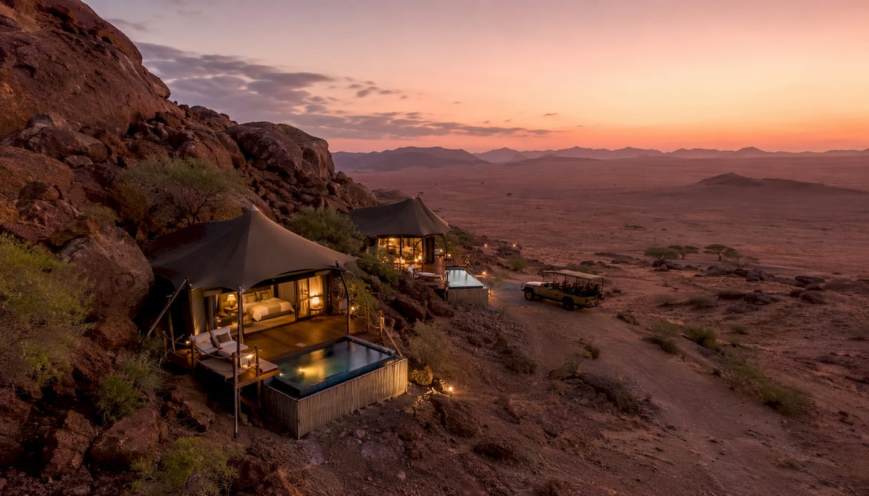 Luxury tented lodges at dusk desert safari