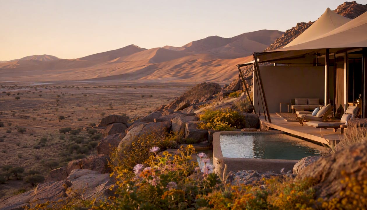 Luxury tented lodge with plunge pool at sunset in Namib desert
