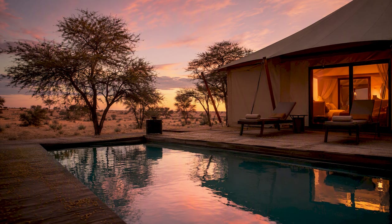 Private plunge pool at luxurious tented camp at dusk